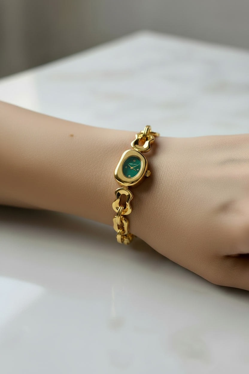 Tiff-any & co gold watch with green dail.